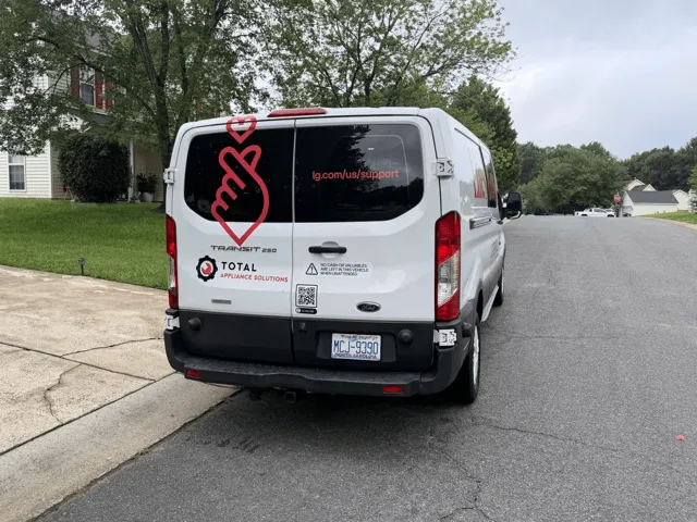 Rear view of a TAS and LG-branded service van