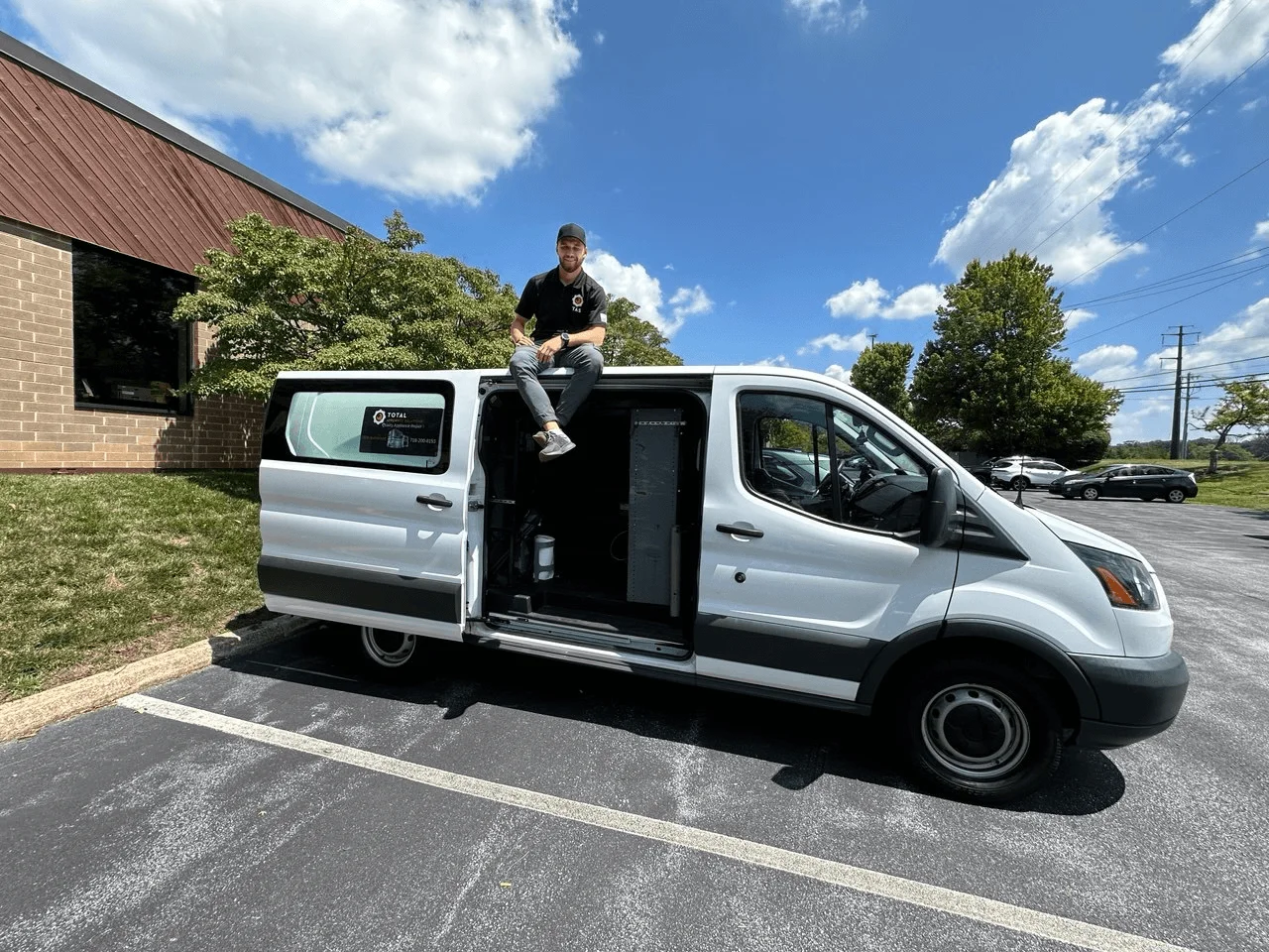 TAS technician with a silver service van