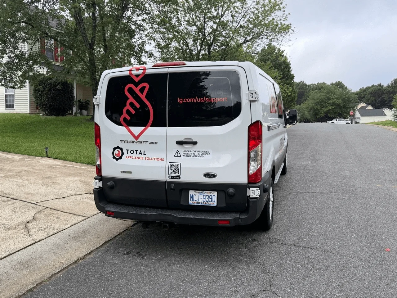 Rear view of a TAS and LG-branded service van